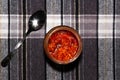 Jar of hot pepper sauce on the table Royalty Free Stock Photo