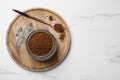 Jar of instant coffee and spoon on white marble table, top view. Space for text Royalty Free Stock Photo