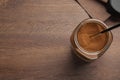 Jar of instant coffee and spoon on table, top view. Space for text Royalty Free Stock Photo