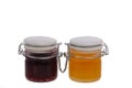 Jar of jam and honey on white background Royalty Free Stock Photo