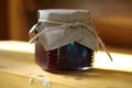 Jar of jam on a wooden shelf Royalty Free Stock Photo