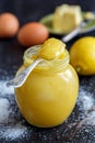 Jar with lemon custard, lemon, egg.