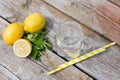 Jar, lemon, mint leaves, and straw on wooden table. Cocktail preparation. Summer. Top view. Summer hilidays. Top view Royalty Free Stock Photo