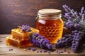 Jar of Liquid Honey with Honeycomb Inside and Bunch of Lavender