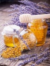 Jar of liquid honey with lavender. artificial