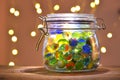 Jar of Marbles and Christmas lights Royalty Free Stock Photo