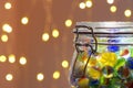 Jar of Marbles and Christmas lights Royalty Free Stock Photo