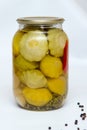 Jar with marinated yellow scallop squash, homemade pickled pattypan squash