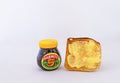 A jar of Marmite breakfast spread with toast