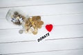 Jar with money on white wood background. Donate conception Royalty Free Stock Photo