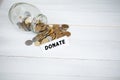 Jar with money on white wood background. Donate conception Royalty Free Stock Photo