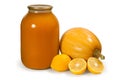 A jar of natural pumpkin juice. Ingredients for canned juice. Fresh pumpkin and lemons.