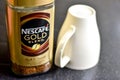 Nescafe Gold Blend instant coffee and cup Royalty Free Stock Photo