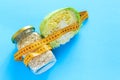 A jar of oatmeal, cabbage and tape measure. The concept of proper nutrition to maintain beauty and health. Weight loss diet. Flat Royalty Free Stock Photo