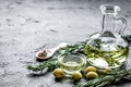 jar with oil with olives on stone table background mockup Royalty Free Stock Photo
