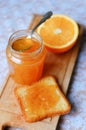 Jar of orange marmalade and toast with orange Royalty Free Stock Photo