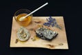Jar with organic honey, honeycomb nut, walnut and lavender on wood Royalty Free Stock Photo