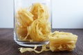 Jar of pasta wooden table