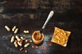 Jar of peanut butter, peanuts in a peel, apple slices and a knife. Royalty Free Stock Photo