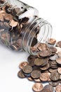 Jar of pennies tipped over Royalty Free Stock Photo