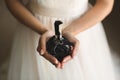 jar of perfume in the hands of the bride. Beautiful wedding manicure.Hands closeup. Wedding morning bride. Royalty Free Stock Photo