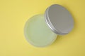 Jar of petroleum jelly on yellow background, top view Royalty Free Stock Photo