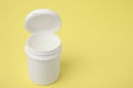 Jar of petroleum jelly on yellow background, space for text Royalty Free Stock Photo