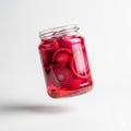 Jar of pickled onions floating in mid air on a solid white background Royalty Free Stock Photo