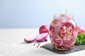 Jar of pickled onions on table Royalty Free Stock Photo