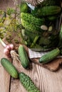 Jar of pickles on wooden table Royalty Free Stock Photo