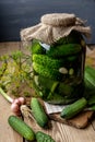 Jar of pickles on wooden table Royalty Free Stock Photo