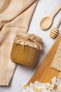 Jar with propolis honey on wooden background top view, flat lay