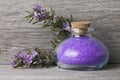 A jar with purple bath salts.