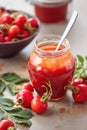 A jar of rose hip jelly and fresh rose hips Royalty Free Stock Photo