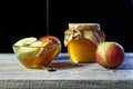 Jar of rustic honey and and apples on wooden table. Traditional celebration food for the Jewish New Year. Concept Rosh Hashana Royalty Free Stock Photo