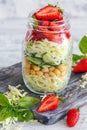 Salad with cabbage, strawberries and basil in jar. Royalty Free Stock Photo