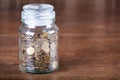 Jar savings spare change concept dark background. Royalty Free Stock Photo