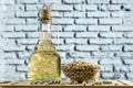 Jar with soybean oil and glass pot  with soybeans on a wooden table Royalty Free Stock Photo