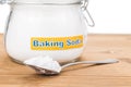 Jar and spoonful of baking soda for multiple holistic usages