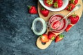 Jar of strawberry jam . Homemade strawberry marmelade and fruits on wooden board. Long banner format