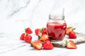 Jar of strawberry jam . Homemade strawberry marmelade and fruits on a light background. place for text, top view