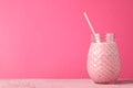 Jar strawberry on pink background. Sweet drink Royalty Free Stock Photo