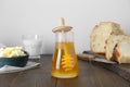 Jar of tasty honey, milk, butter and bread on wooden table Royalty Free Stock Photo