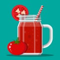 Jar with tomato smoothie with striped straw. Royalty Free Stock Photo