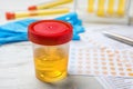 Jar with urine sample on table. Urology concept Royalty Free Stock Photo