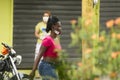 Jarabacoa ,La Vega / Dominican Republic - May 23, 2020 : an immigrant Haitian young woman walking in the streets of Dominican