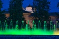 Jardines de Triunfo and fountain of color green at night, Granada, Spain