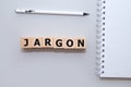 Jargon - word from wooden blocks with letters, special words and phrases jargon concept, top view on white background Royalty Free Stock Photo