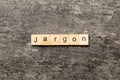 Jargon word written on wood block. Jargon text on cement table for your desing, Top view concept