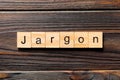 Jargon word written on wood block. Jargon text on wooden table for your desing, Top view concept Royalty Free Stock Photo
